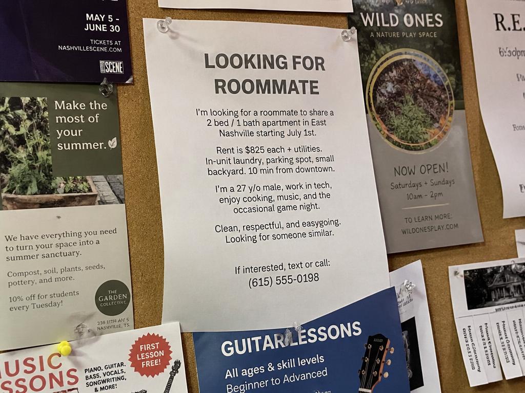A flyer pinned to a community bulletin board among other notices